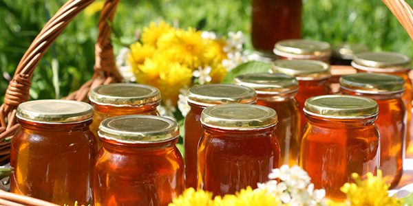  Honey poured in cans and ready for sale or storage