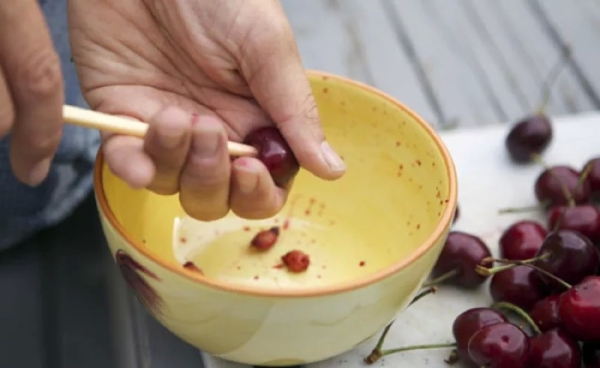  You can remove the bone from the cherry either manually or using various devices.