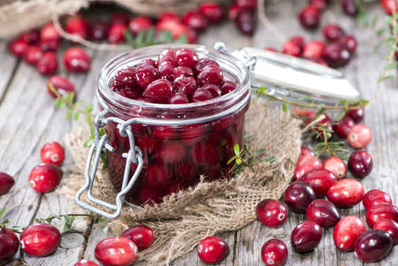  A jar of cranberries stored in the winter in the refrigerator